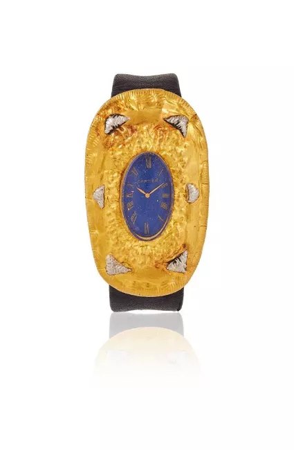 Front view of the Cartier dress watch designed by Lisa Sotilis, showing the bi-colour hammered bezel and blue dial