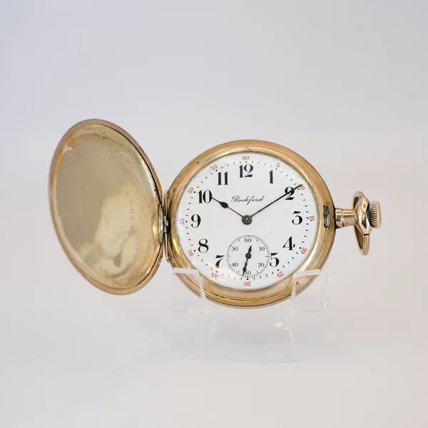 Front view of Rockford 12s hunter pocket watch with front cover open showing dial and hands
