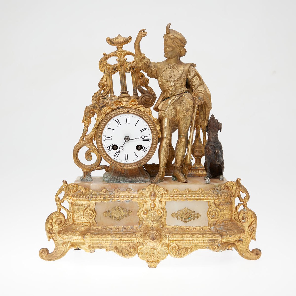 Frontal view of the gilt bronze Vincenti & Cie mantel clock with figural group and enamel dial