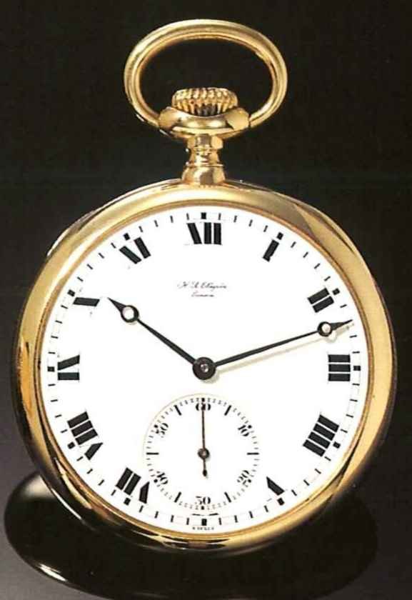 Front view of the 18k gold pocket chronometer showing the enamel dial and blued steel hands.