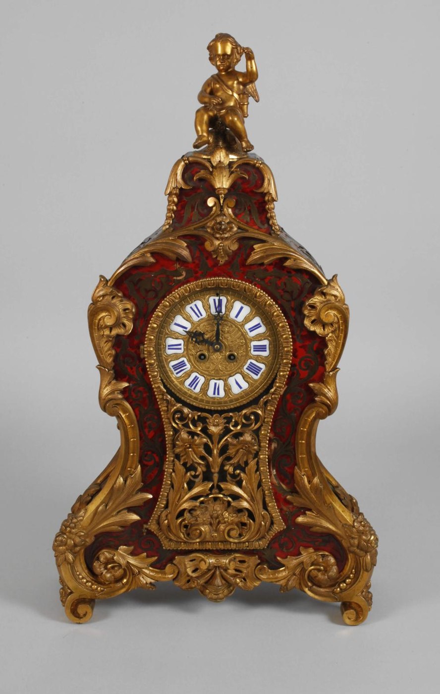 Frontal view of the Louis XV style Boulle clock with Cupid finial.