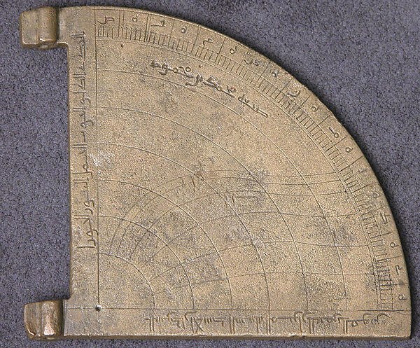 Front view of the brass horary quadrant showing incised inscriptions, scales, and two side lugs.