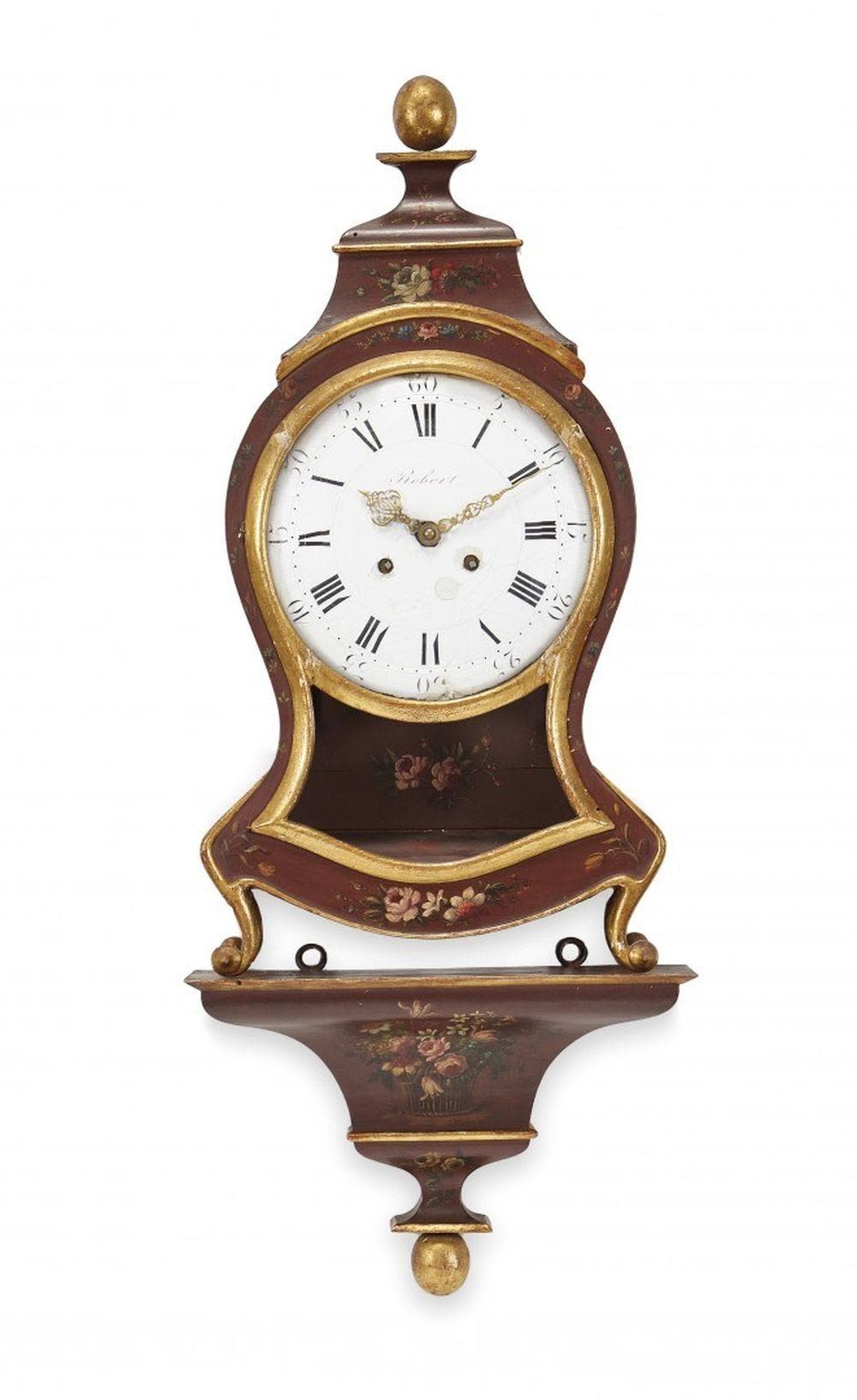 Front view of the bordeaux lacquered Neuchâtel pendulum clock positioned on its matching console