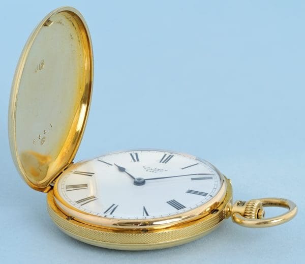 Nicole Nielsen 18-carat gold hunter pocket watch with open cover showing the white enamel dial
