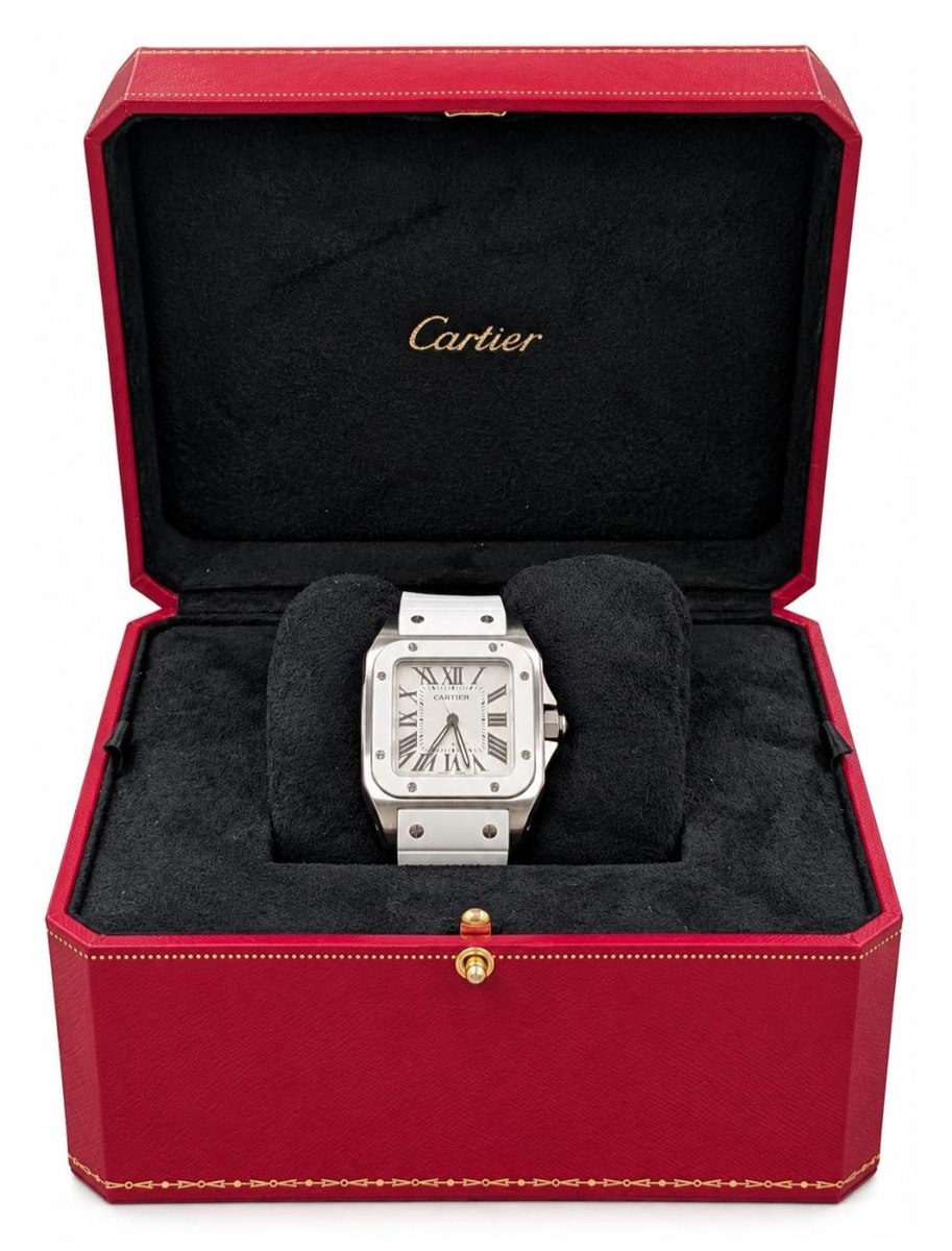 Cartier Santos 100 wristwatch mounted on a cushion inside an open red presentation box