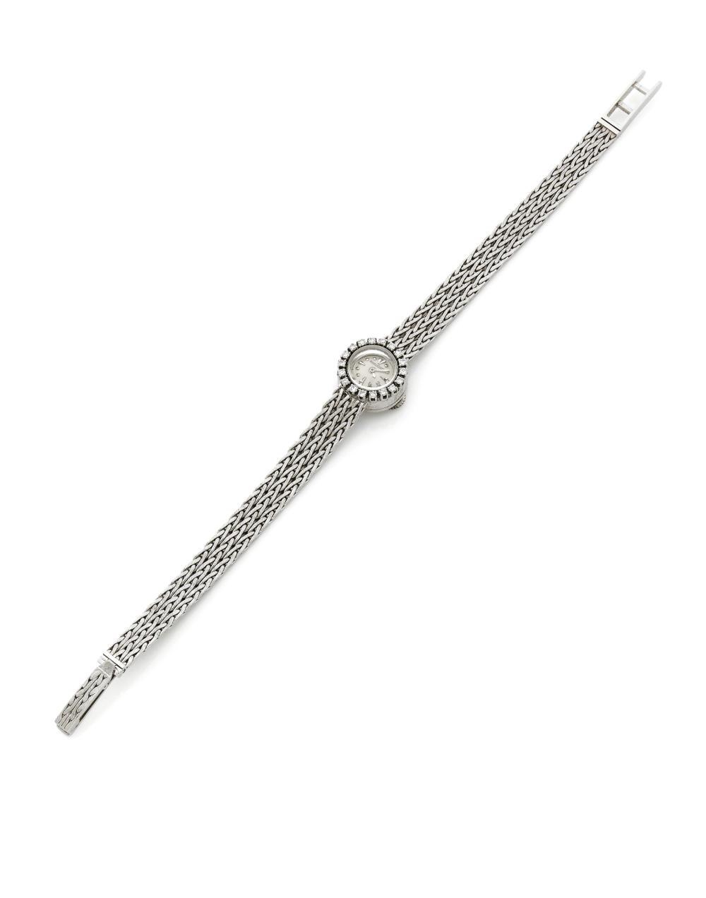 Full view of the 18k white gold Jaeger-LeCoultre wristwatch with braided bracelet.