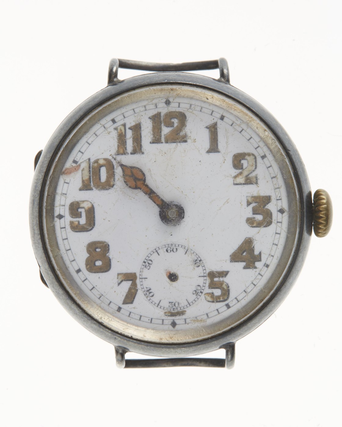 Front view of the trench watch showing the enamel dial, numerals, and missing hands.