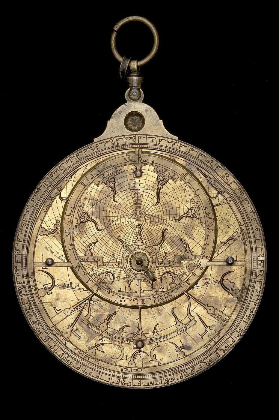 Front view of the brass astrolabe showing the rete, throne, and limb scale.