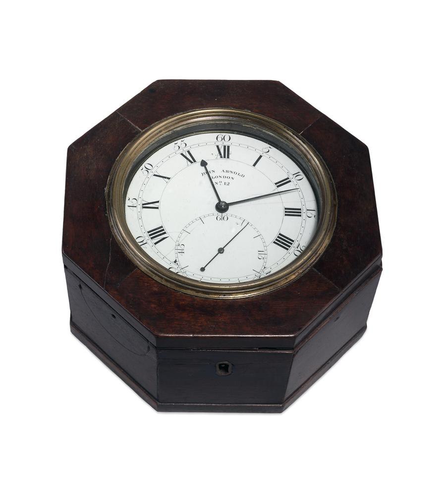 Oblique overhead view of John Arnold Marine Chronometer No. 12 in its octagonal mahogany case