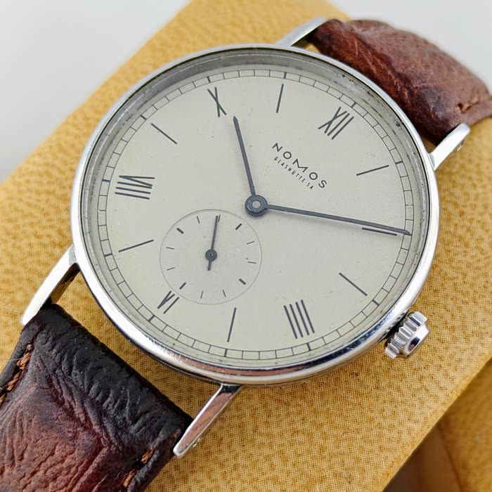 Dial view of the Nomos Glashütte Ludwig wristwatch with sub-seconds dial and brown leather strap