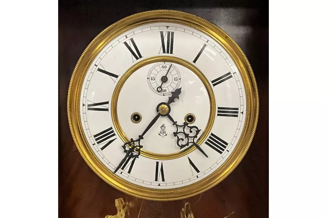 Dial and bezel of the Vienna regulator wall clock showing Gustav Becker logo and subsidiary dial