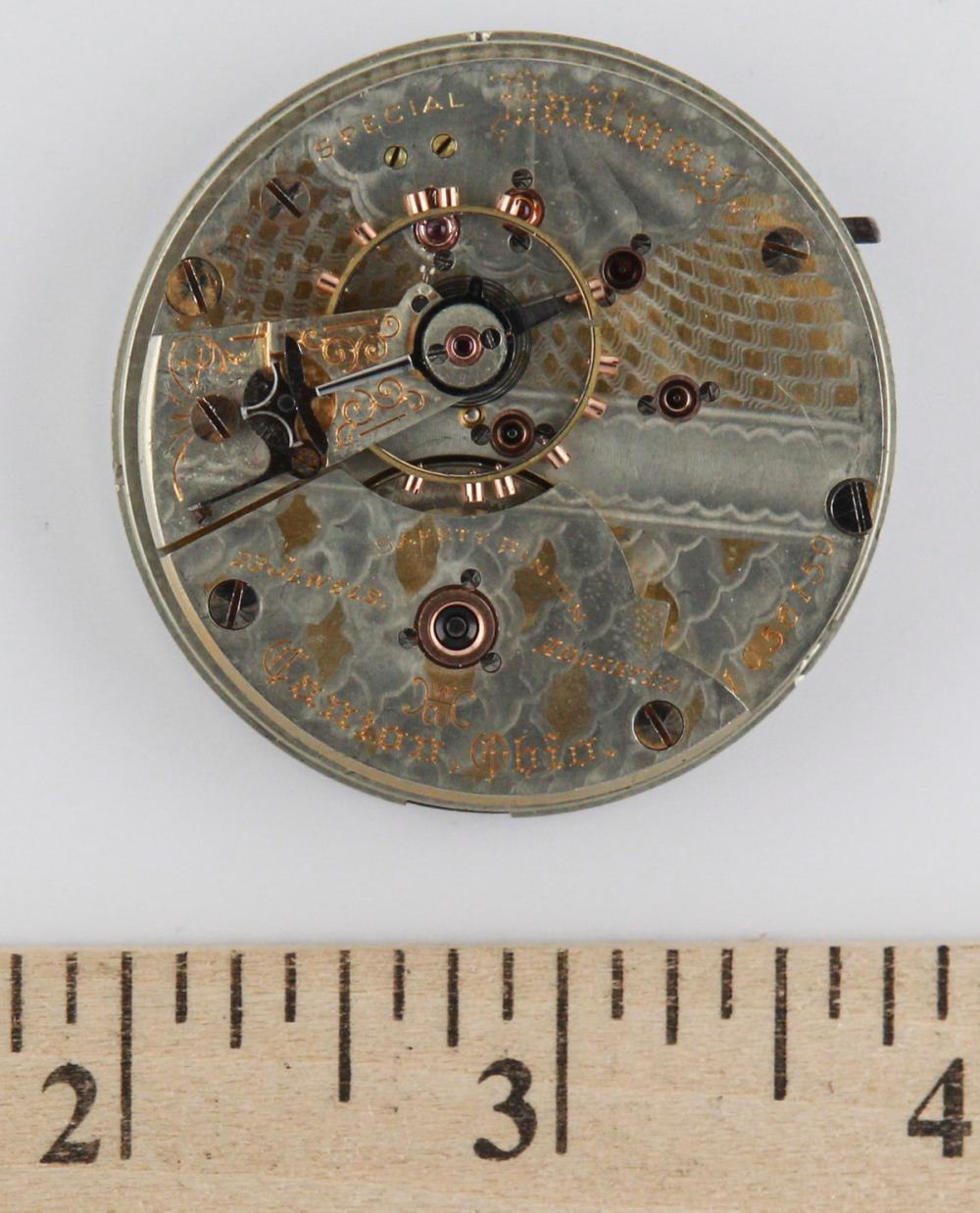 View of the Hampden watch movement from the rear, showing the engraved bridges and serial number 1055159.