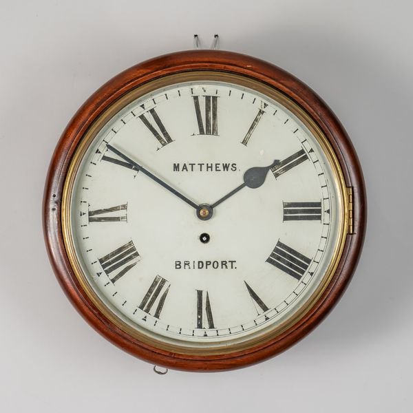 Front view of the Victorian mahogany dial clock signed Matthews, Bridport