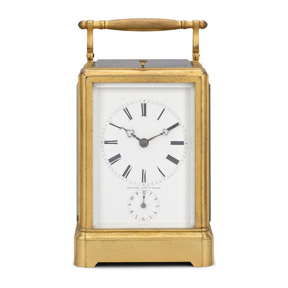Front view of the Raingo Frères brass carriage clock with white enamel dial and subsidiary alarm dial