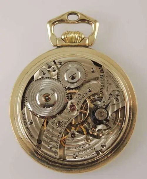 Movement view showing circular damascening, 23 jewels, stirrup bow, and serial number B64969
