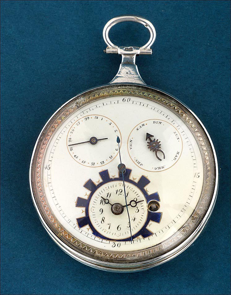 Dial view of the silver verge fusee pocket watch showing central seconds, day and date subdials, and lower time subdial