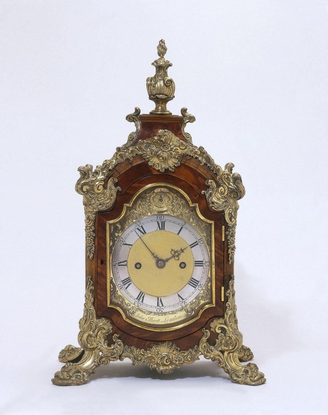 Table clock with walnut case and silver-gilt mounts by John Ellicott, London, circa 1740-1750.